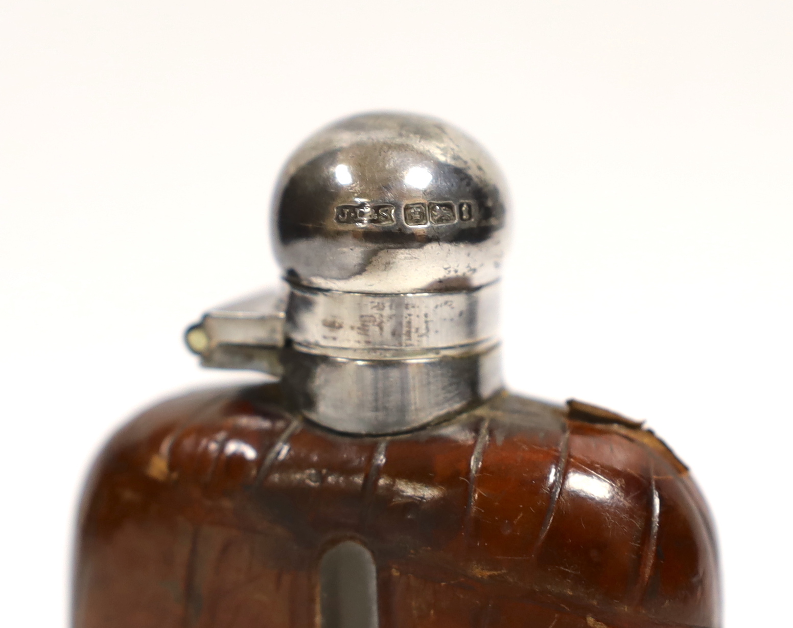 A small George V silver and crocodile skin mounted glass hip flask by James Dixon & Sons Ltd, Sheffield, 1911, 10.1cm.